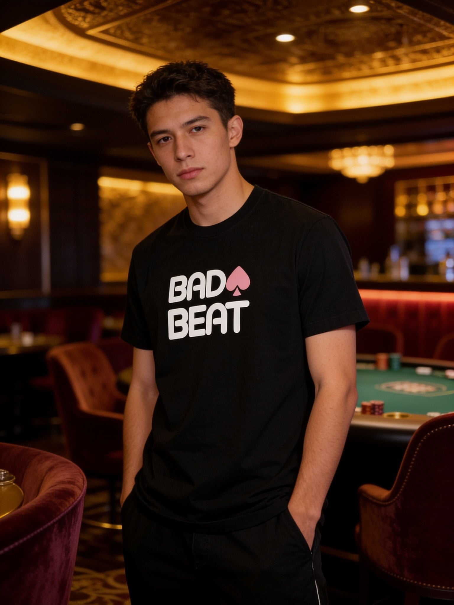 Model wearing the black Bad Beat T-shirt in a card room